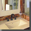 Detail View of Durango Travertine Vanity with Red Onyx Splash & Shower Trim